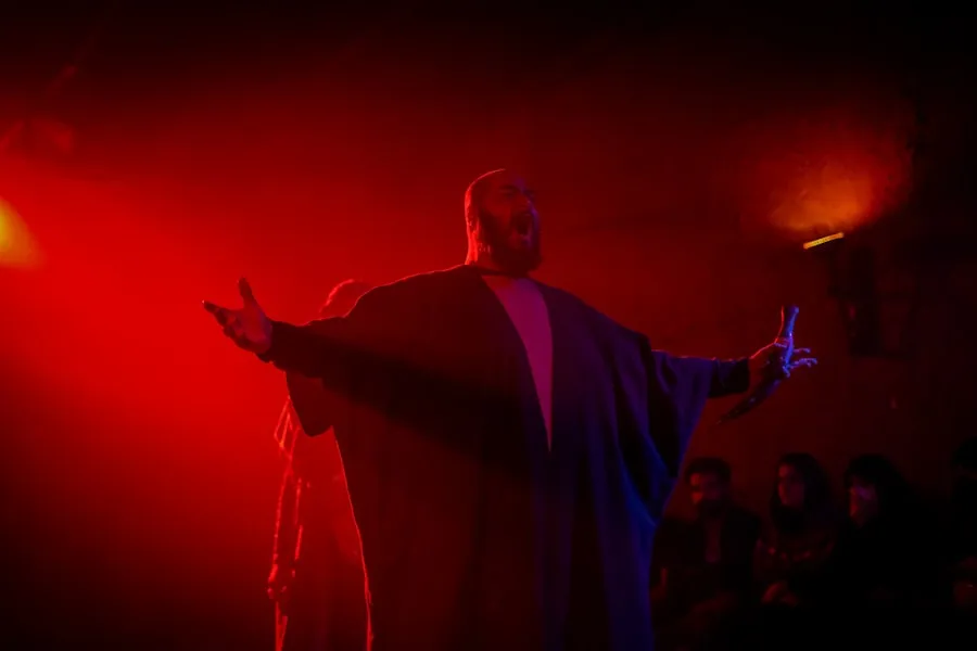 A performer under red light